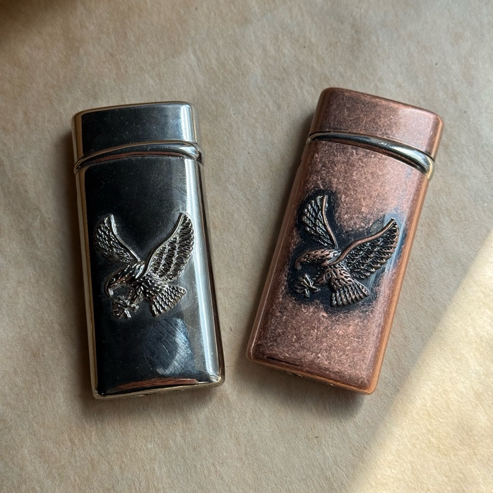 Sleek vintage Silver and Brown Eagle lighters